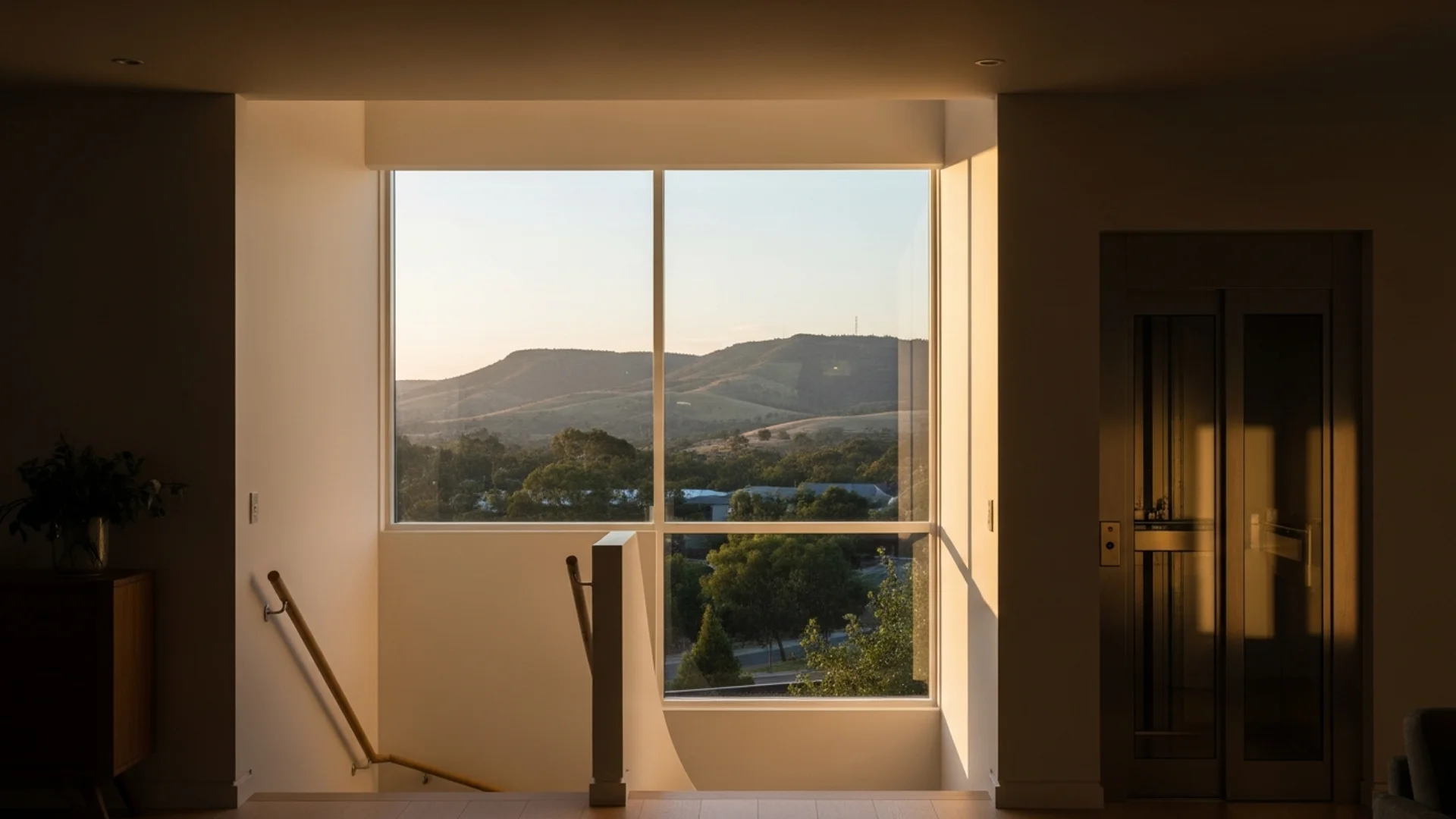Contemporary Adelaide home with a discreet residential lift beside a bright internal staircase